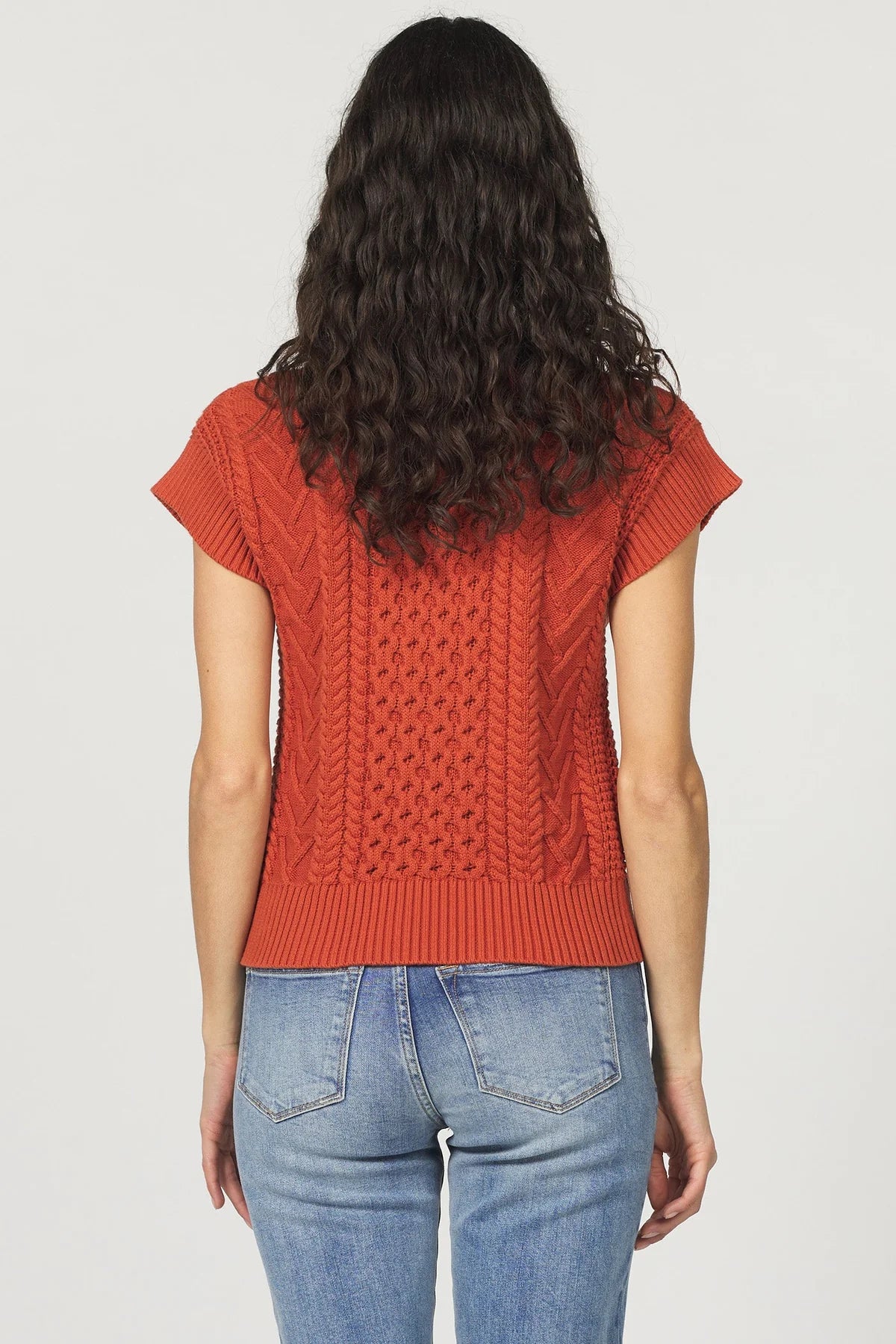 Scout Cable Sweater Vest in orange maple by Another Love
