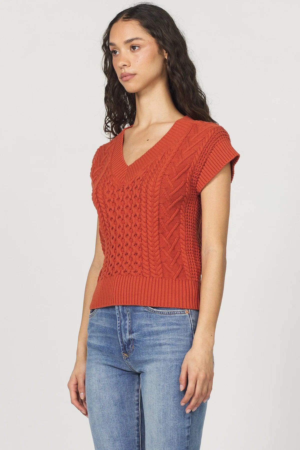 Scout Cable Sweater Vest in orange maple by Another Love