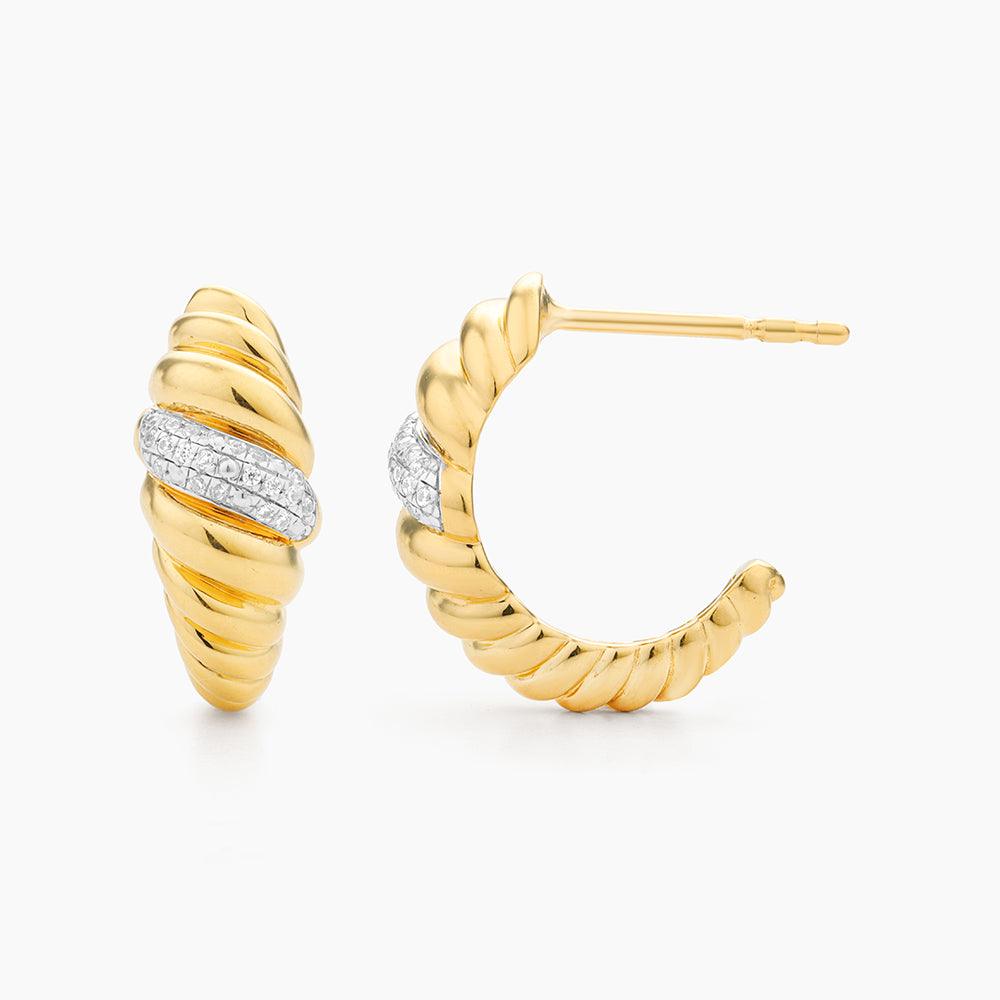 Croissant Dome Huggie Earrings in gold by Ella Stein