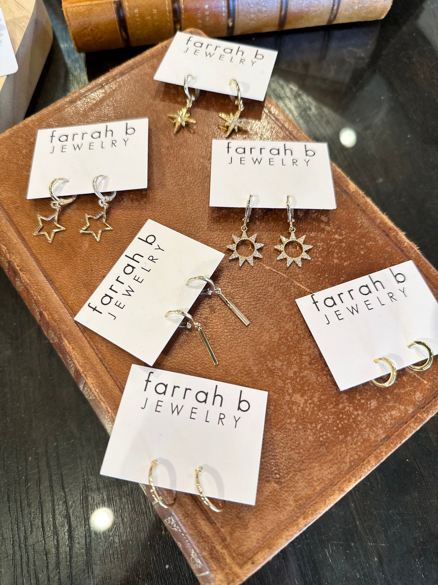 Star Huggie Earrings in gold by Farrah B
