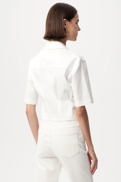 Model wearing white exquise top back view 