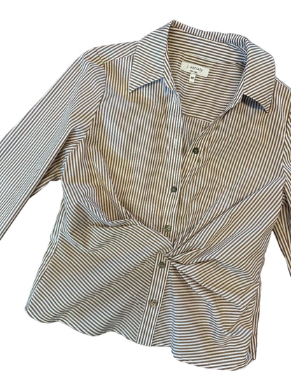 A long-sleeve button-up shirt with thin brown and white vertical stripes