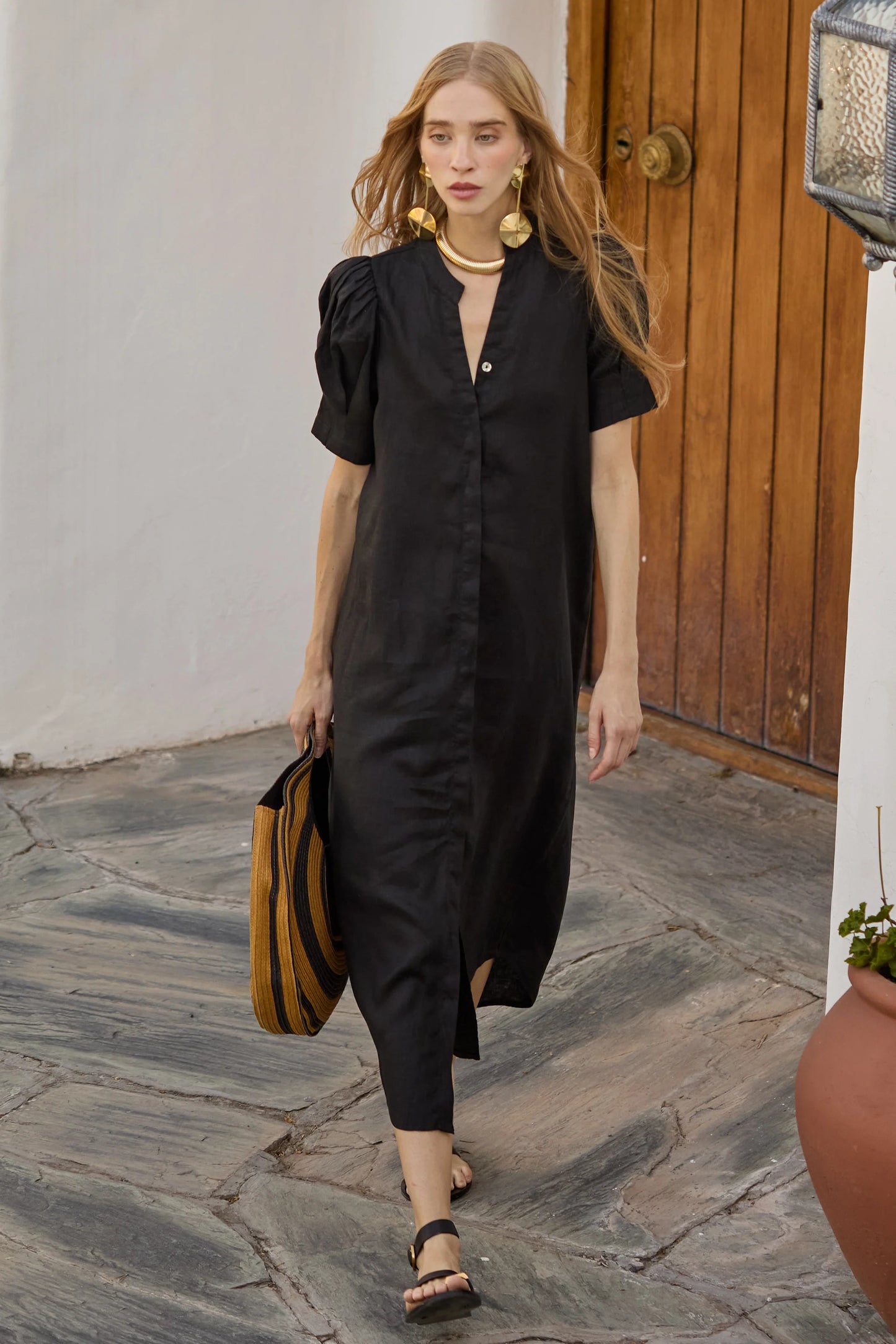 model wearing black linen midi dress chic spring outfit inspiration 