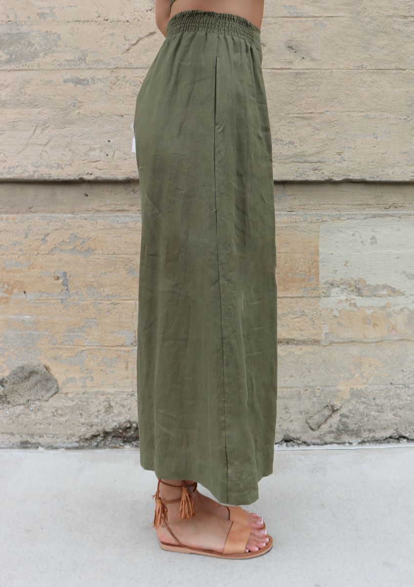 model wearing green wide leg linen pants by bel kazan 