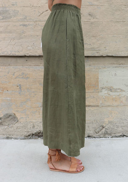 model wearing green wide leg linen pants by bel kazan 