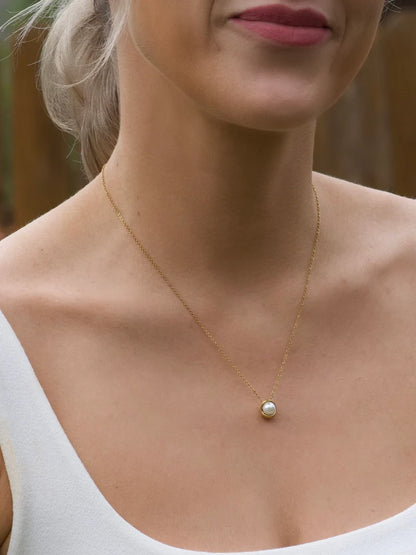 Enamored Pearl Necklace in gold by Farrah B