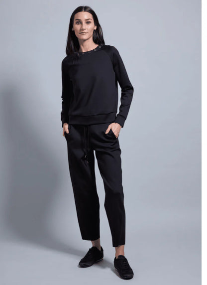 Desi Grommet Detail Neoprene Pullover in black by Lysse