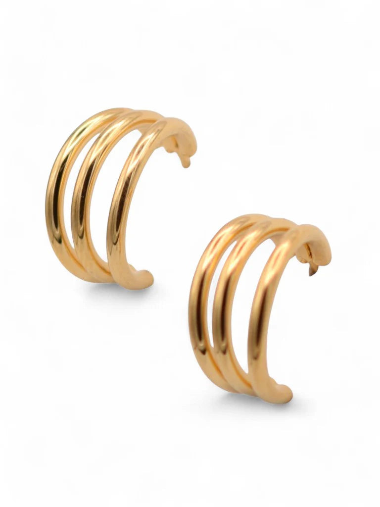 Retrograde Huggie Earrings in gold by Farrah B