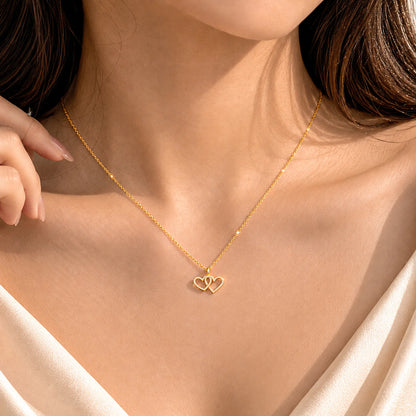 Two Hearts Pendant Necklace in gold by Ella Stein