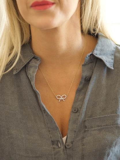 Prim & Proper Bow Necklace in gold by Farrah B