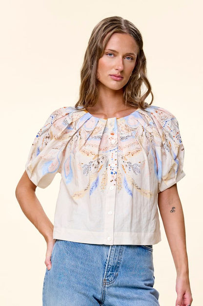 Model wearing button up cotton top by cleobella 
