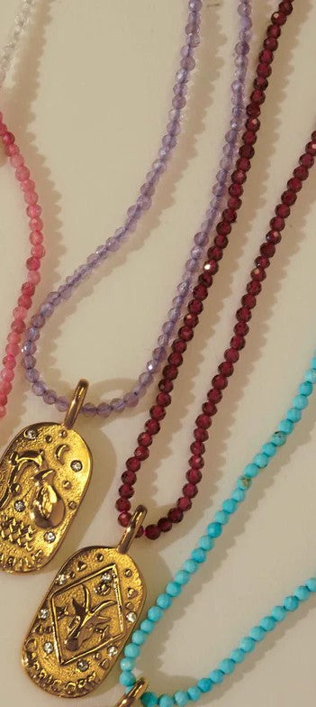 Sunrise Zodiac Necklaces in gold by Kozakh