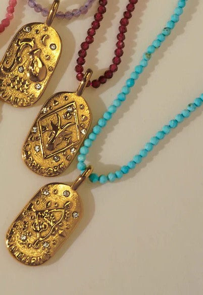 Sunrise Zodiac Necklaces in gold by Kozakh
