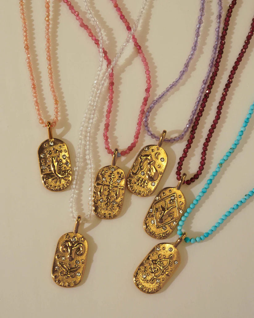 Sunrise Zodiac Necklaces in gold by Kozakh