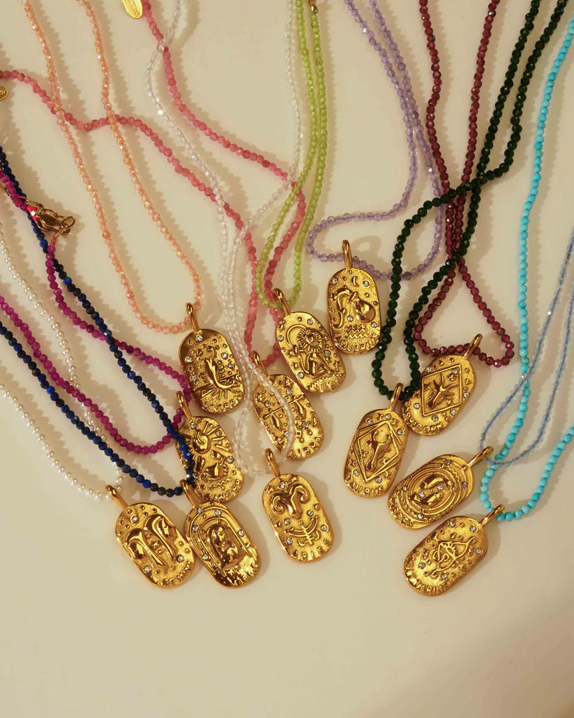 Sunrise Zodiac Necklaces in gold by Kozakh