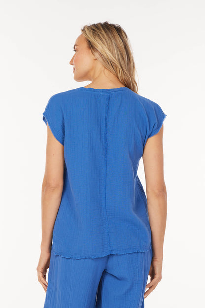 backview of blue cotton blouse with dolman sleeves 