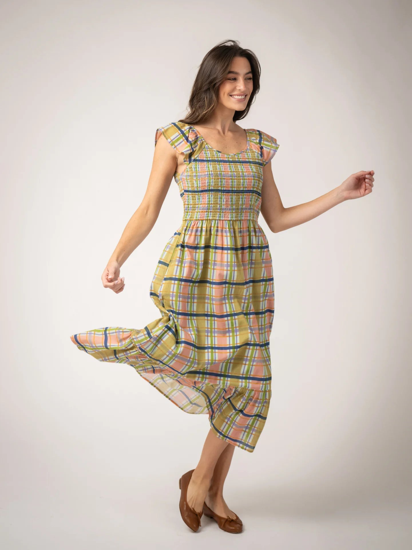 Model wearing beau and ro goldie dress styled with ballet flats 