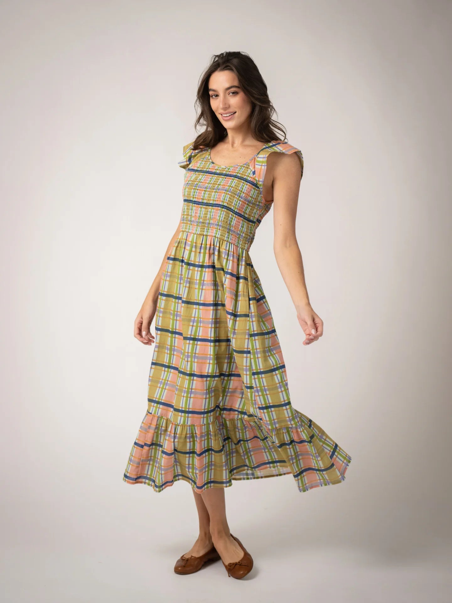 model wearing plaid cotton midi dress with smocking detail 