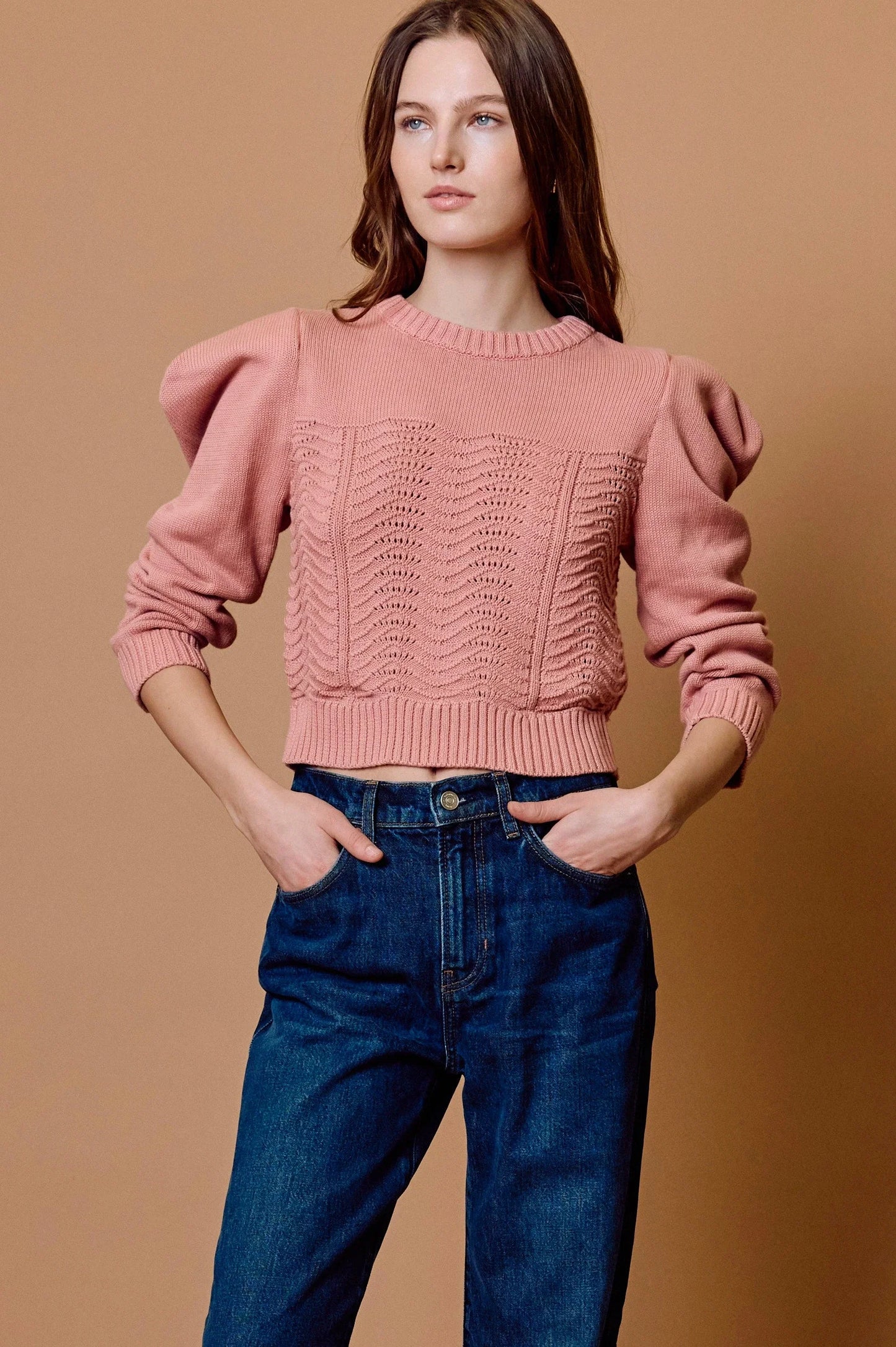 savvy | retail therapy woman wearing a blush colored cotton sweater styled with jeans for fall. 