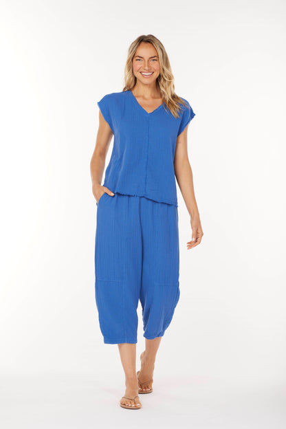 Woman wearing a blue outfit on a white background