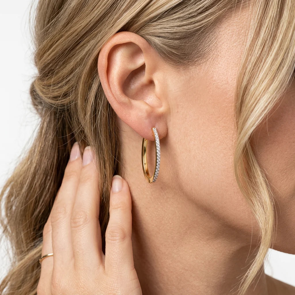 Slim Medium Pave Diamond Huggie Earring in gold by Ella Stein