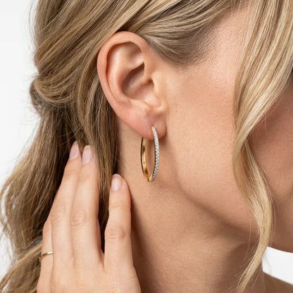 Slim Medium Pave Diamond Huggie Earring in gold by Ella Stein
