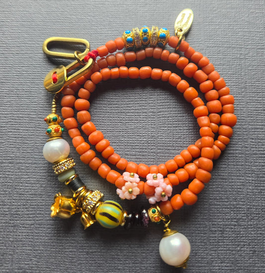 Beaded Charm Necklace in orange by Meredith Waterstraat