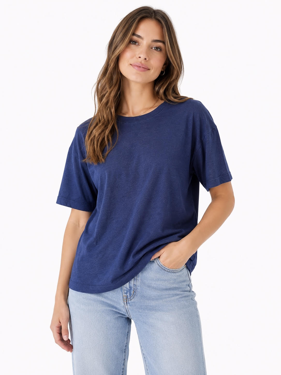 model wearing a blue crew neck t-shirt styled with jeans