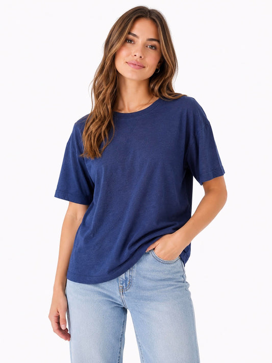 model wearing a blue crew neck t-shirt styled with jeans