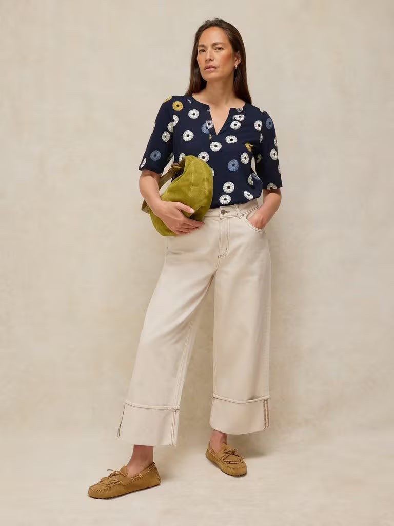 SavVy | Retail Therapy model wearing navy printed notch t-shirt styled with bag