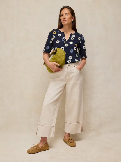 SavVy | Retail Therapy model wearing navy printed notch t-shirt styled with bag