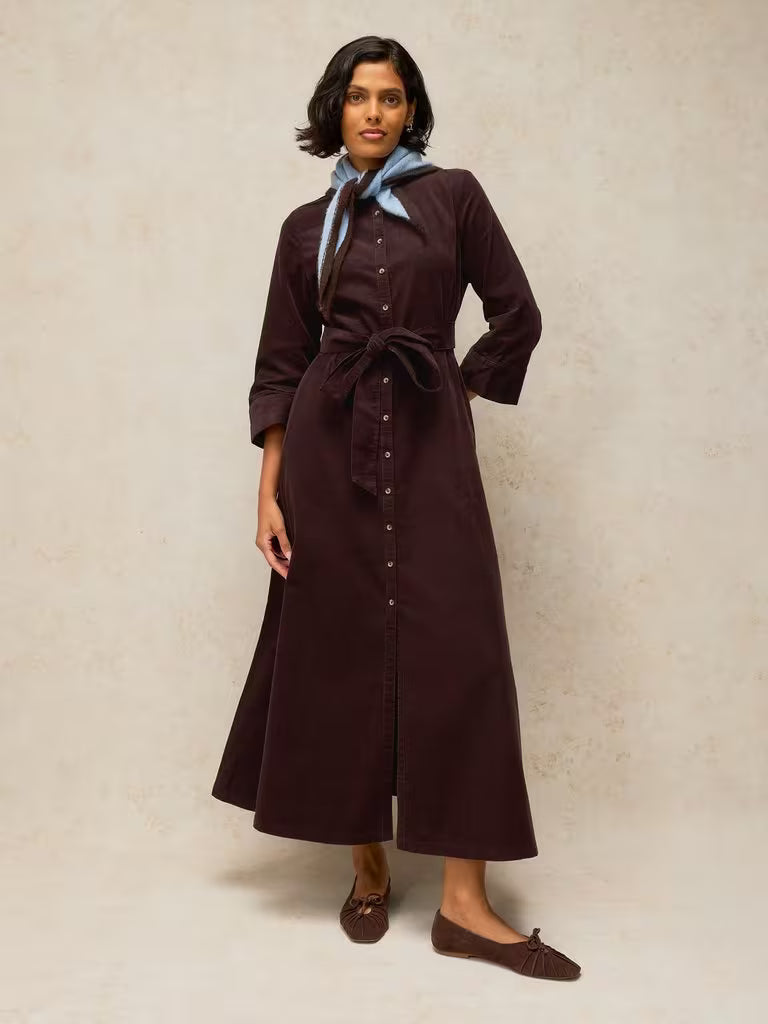 savvy| retail therapy model wearing a slim fit dark brown corduroy shirtdress styled with a neck scarf for fall