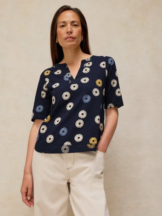 SavVy | Retail Therapy weaver notch top in navy print on model 