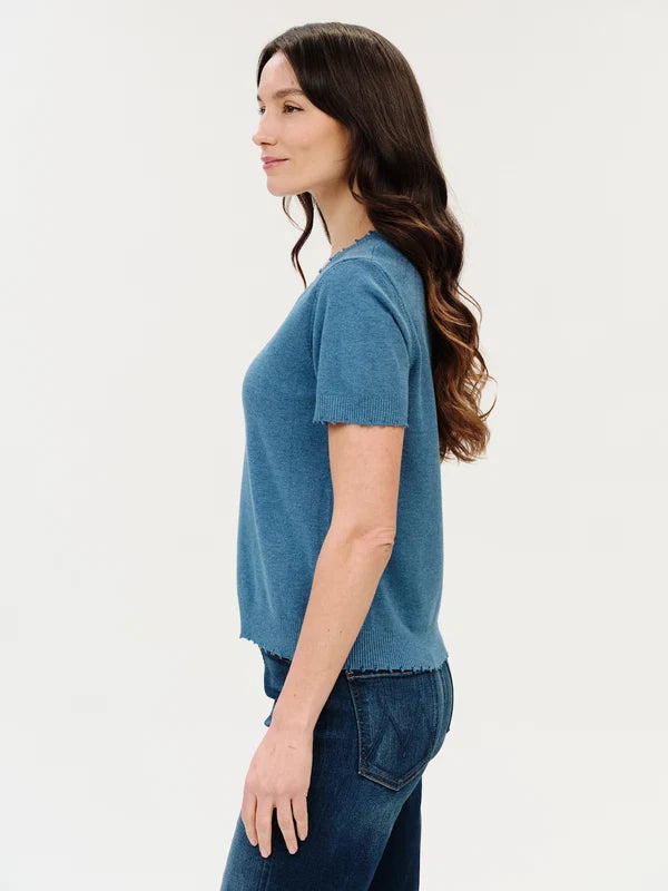 savvy womens boutique greenville south carolina sideview of model wearing blue short sleeve sweater with frayed detailing