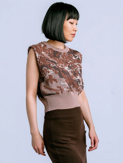 Woman wearing a brown patterned knit sweater vest