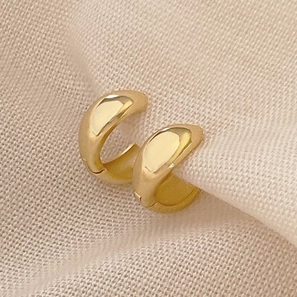 Karma Earrings in gold by Splash