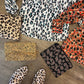 Animal Print Cowhide Clutch in leopard/light brown