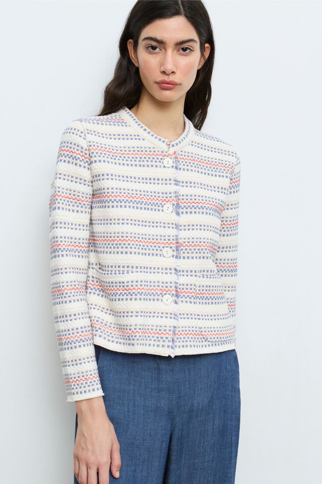 model wearing woven sweater jacket in white by aldo martins front view 