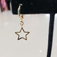 Star Huggie Earrings in gold by Farrah B