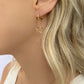 Star Huggie Earrings in gold by Farrah B